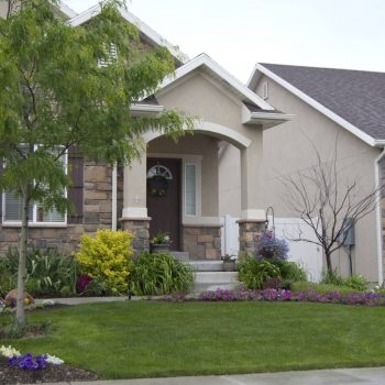 House with lovely yard and landscaping.